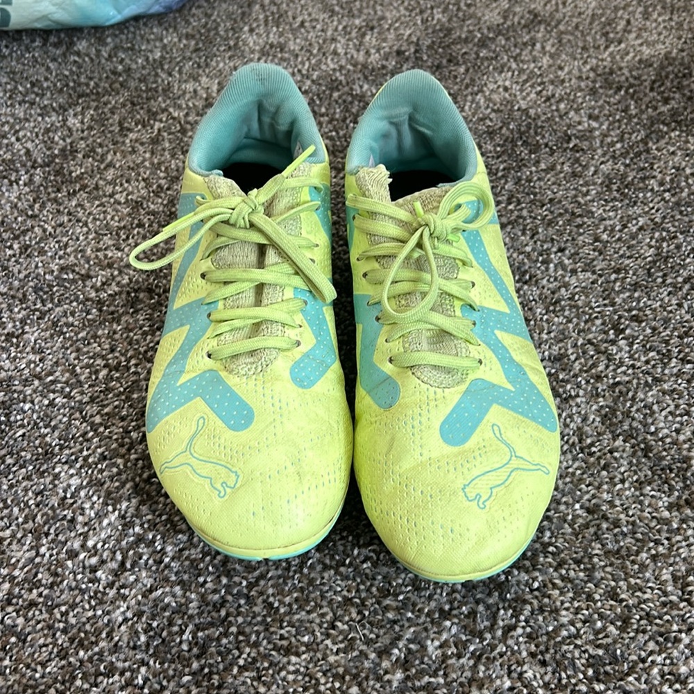 Green and blue puma soccer cleats